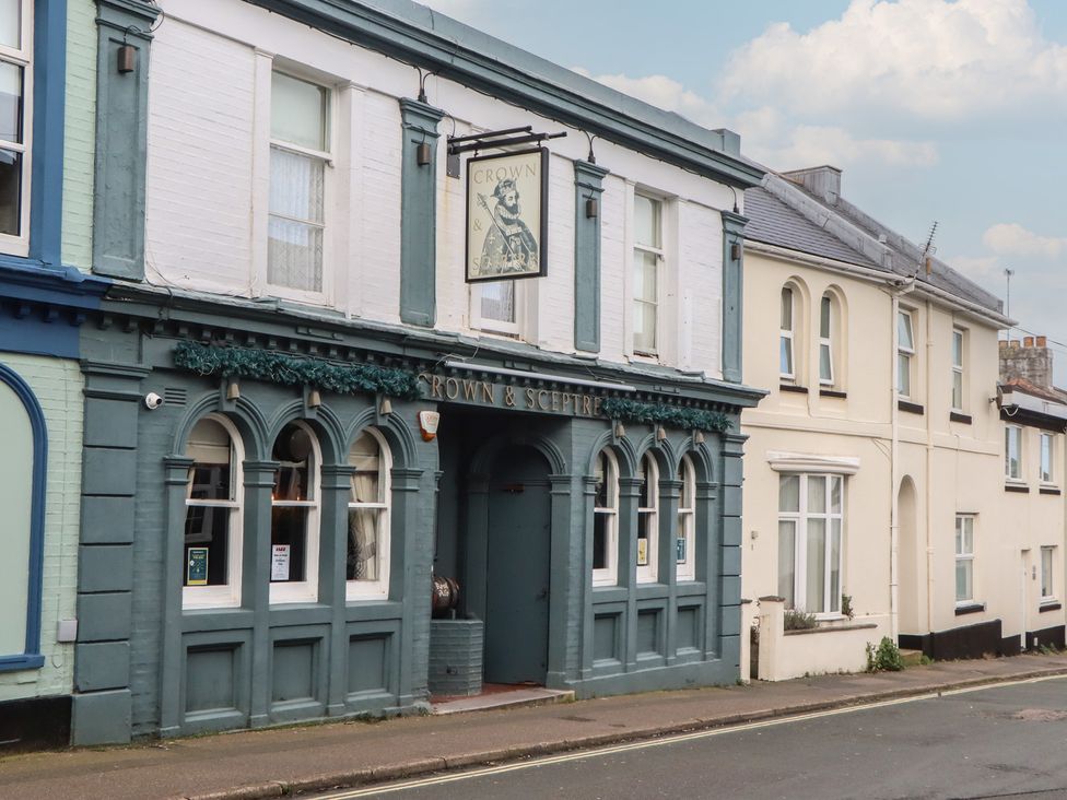 A pub facade with a sign at Crown & Sceptre in 
