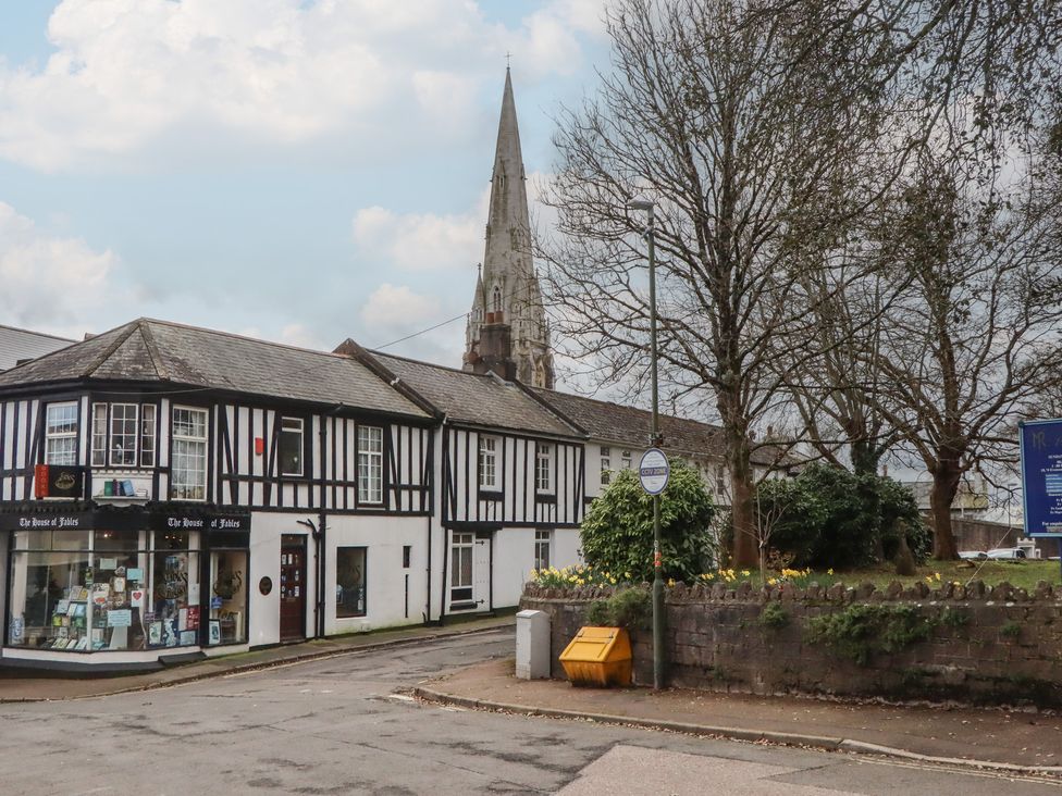 A street view with a building and a church spire at Petitor Mews 