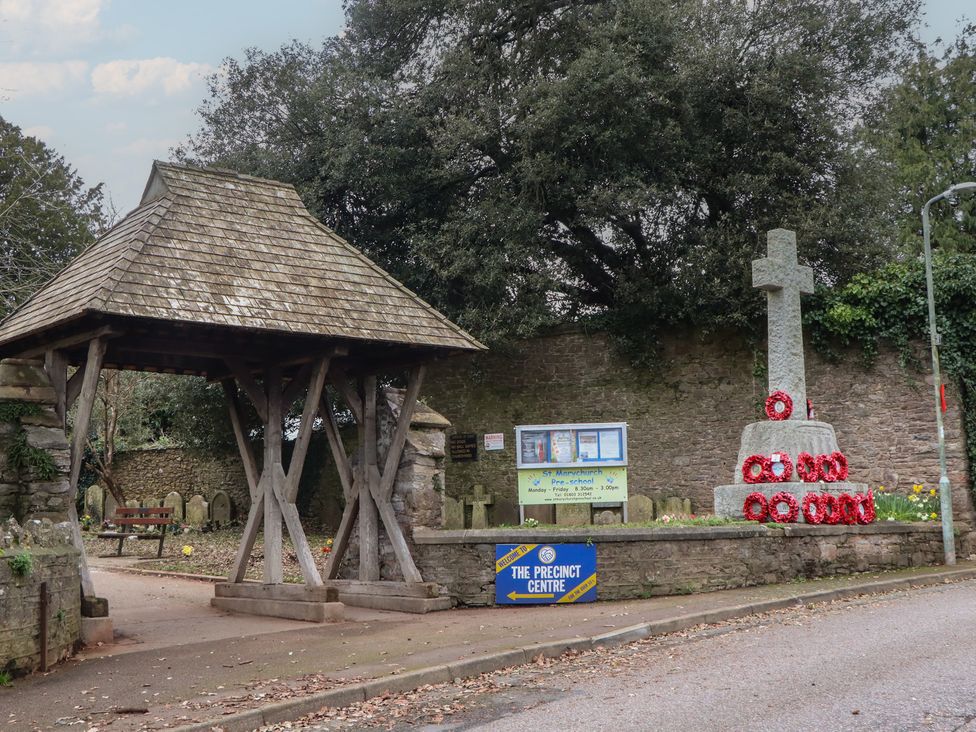 A memorial with a cross and gazebo at The Precinct Centre