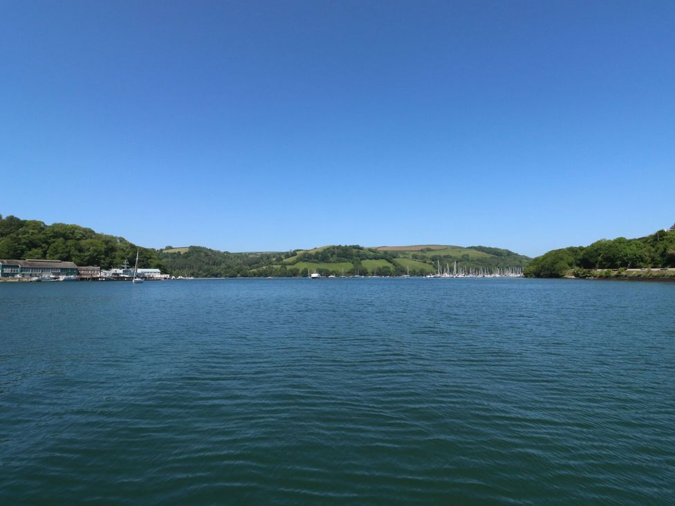 A view of water with boats and land in the background at Petitor Mews, 