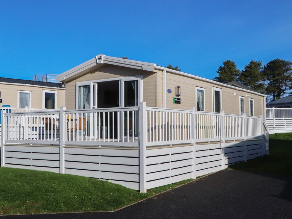 A mobile home with a deck at Caravan C31 at Landscove Holiday Park Brixham