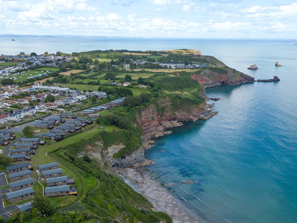An aerial view of the coastline with holiday park and sea at Caravan C31 at Landscove Holiday Park, Brixham