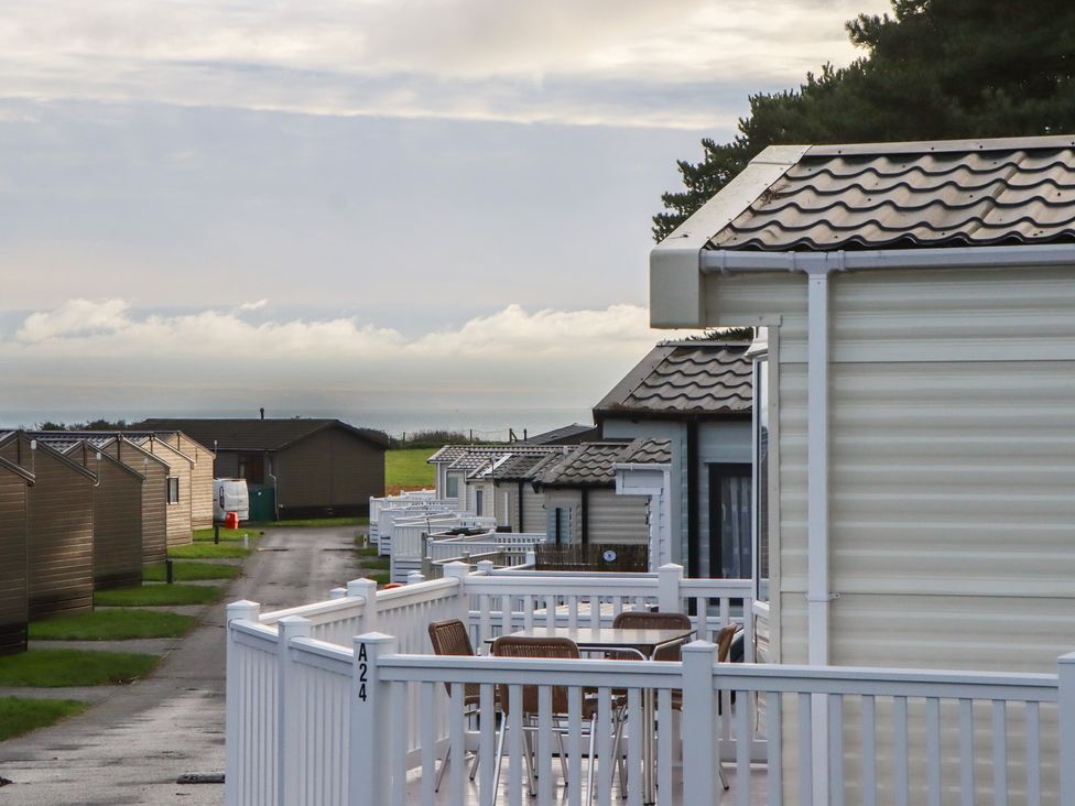 A pathway between caravans at Caravan A24 at Landscove Holiday Park Brixham