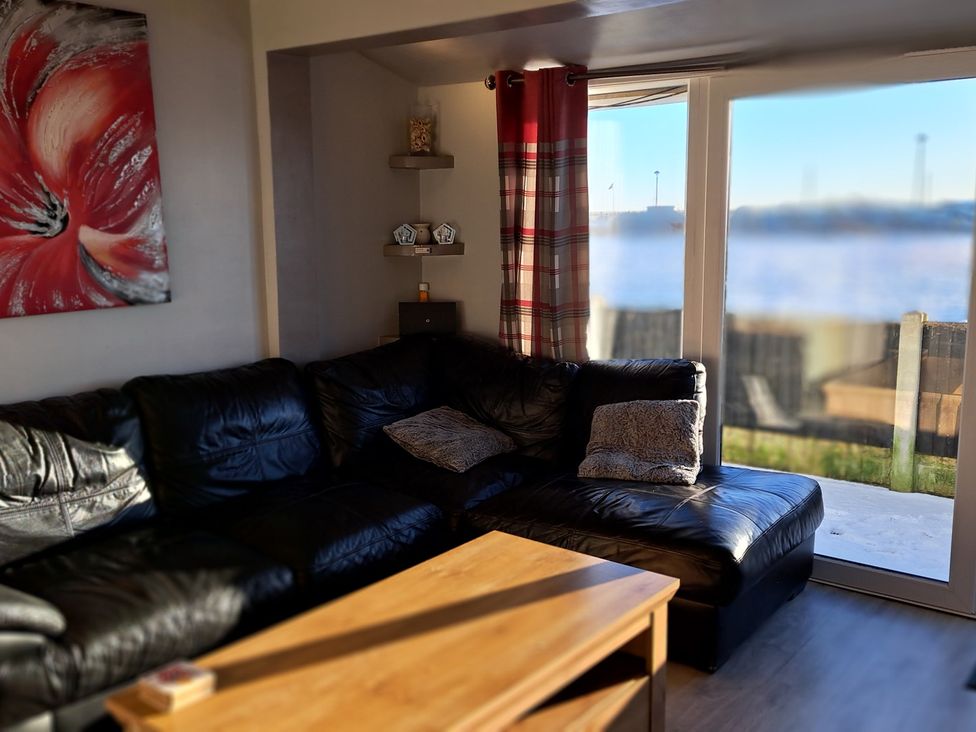 A living room with a sofa and coffee table at Sea View Retreat in Bridlington