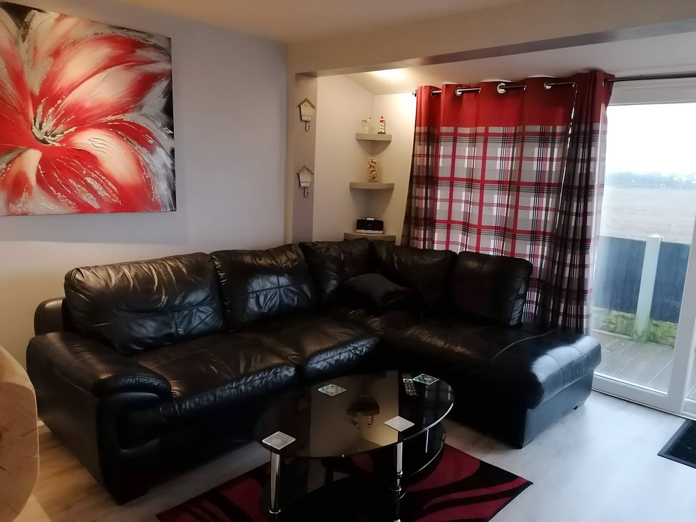 A living room with a sofa and coffee table at Sea View Retreat in Bridlington