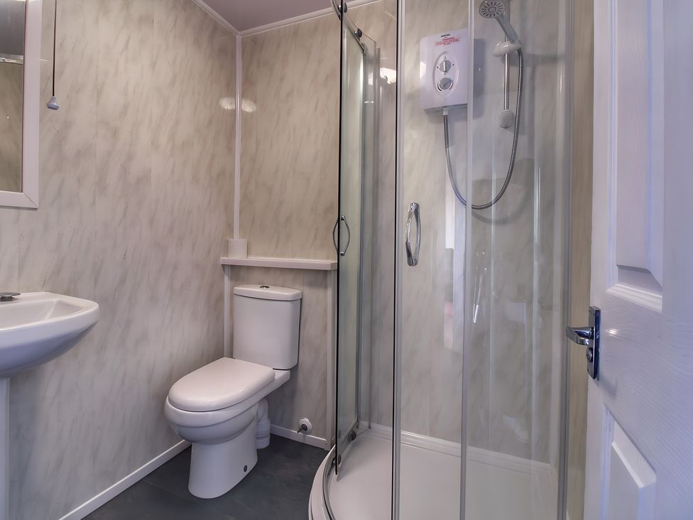 A bathroom with a shower and toilet at Sea View Retreat in Bridlington