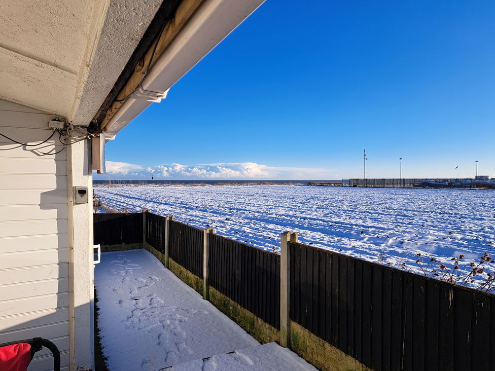 A view of a field covered in snow from a property at Sea View Retreat Bridlington