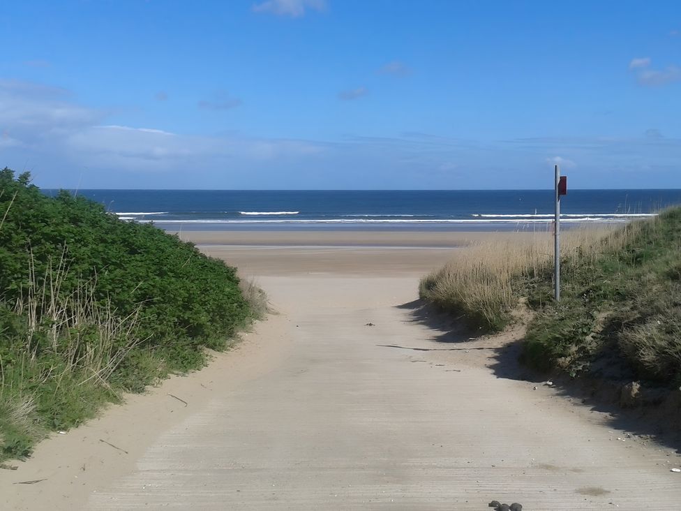 A pathway leading to the ocean at Sea View Retreat in Bridlington