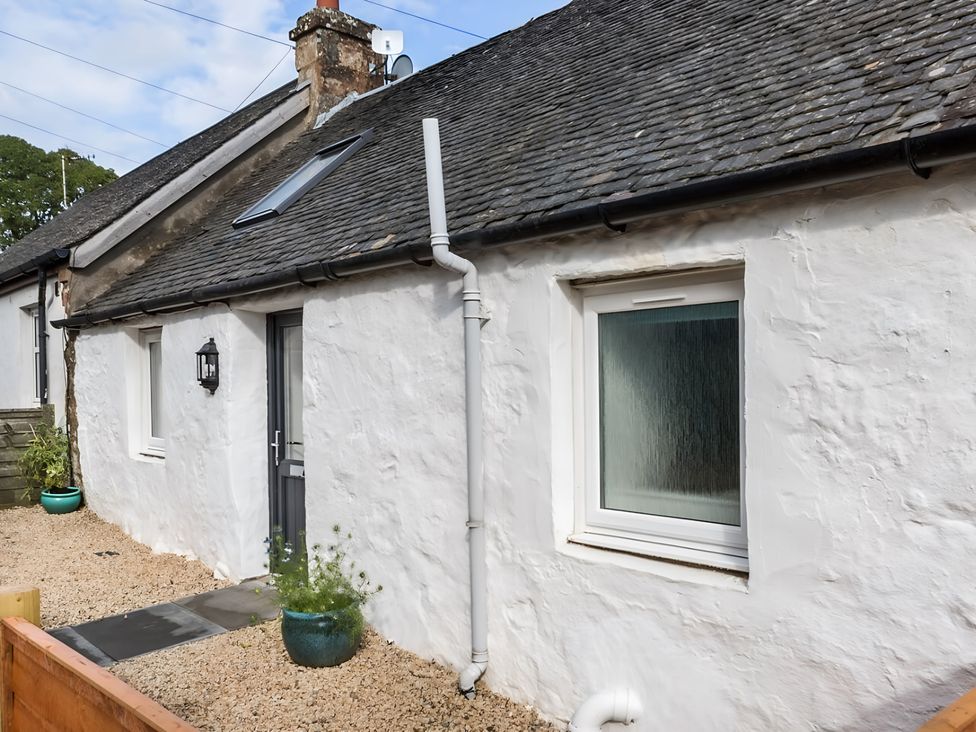 A cottage exterior with window and door at Shedog Cottage Isle of Arran