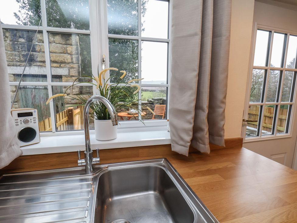 A kitchen with a sink and window at 4 Lilac Cottages