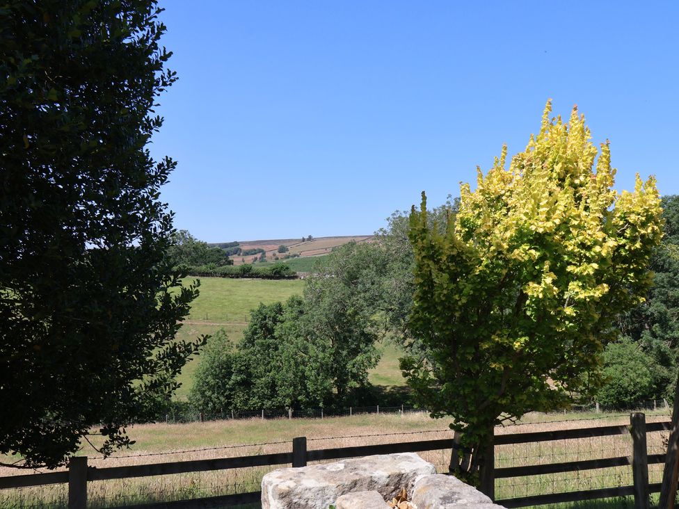 A view of trees and fields at 4 Lilac Cottages in Ainthorpe