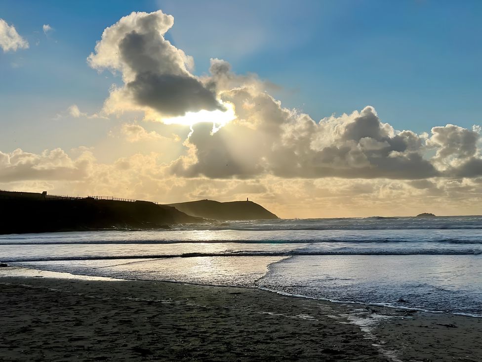 A beach scene with clouds and waves at Pityme-Not Wadebridge