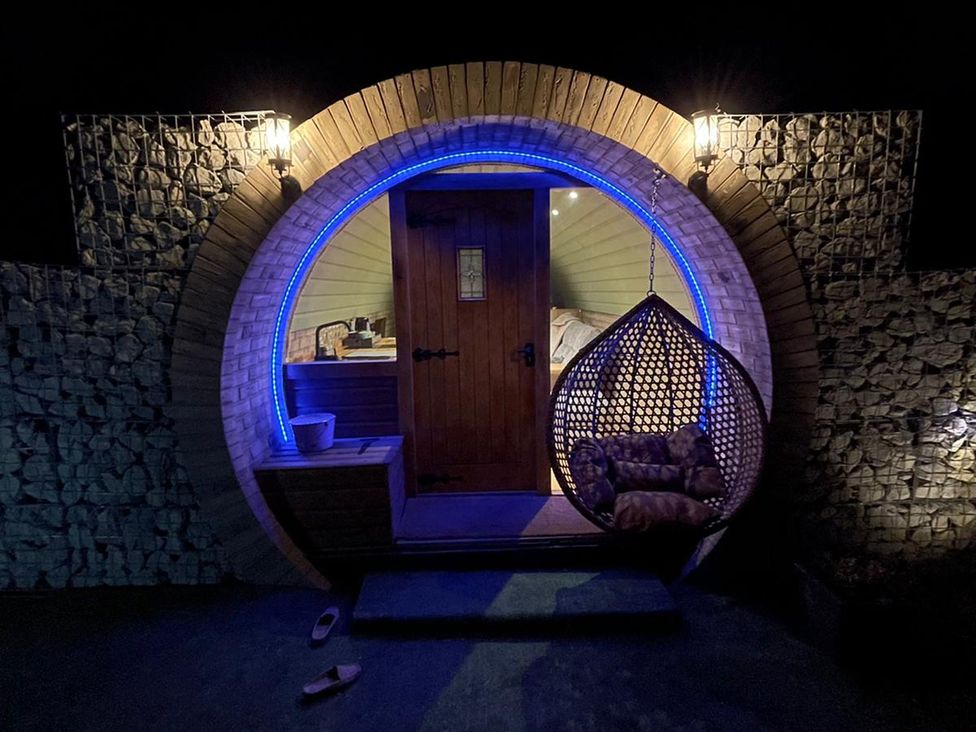 An entrance with a door and hanging chair at Cosy Escape in Sheerness