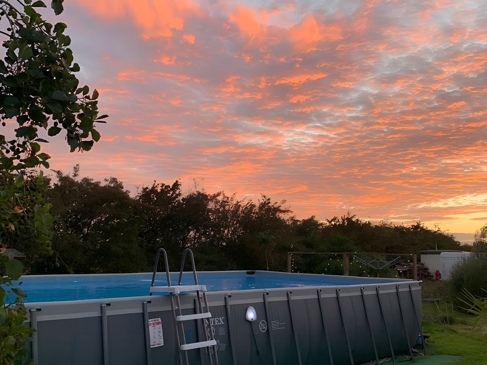 A swimming pool with a ladder at Cosy Escape in Sheerness