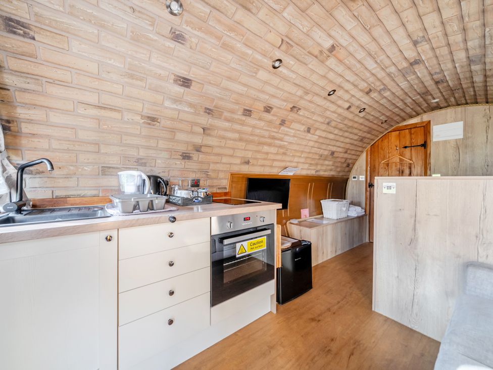 A kitchen with a counter and appliances at Cosy Escape in Minster On Sea