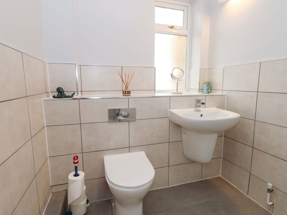 A bathroom featuring a sink and toilet at 15 Coombe Avenue
