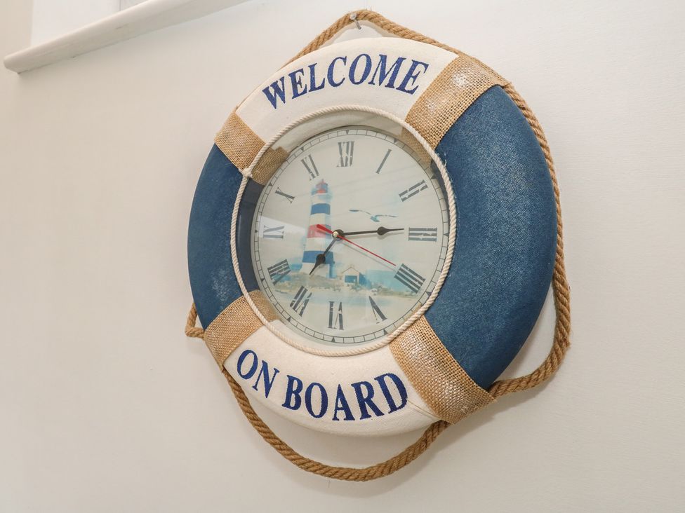 A wall clock designed as a lifebuoy at Tudor Rose in Weymouth
