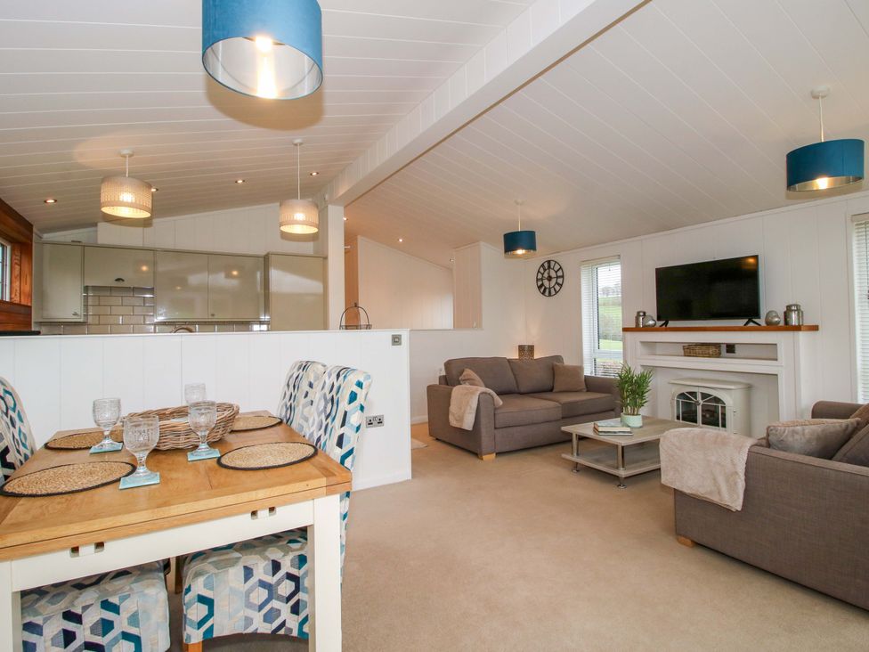 A living room with a sofa and coffee table at 5 Hillview Lodges in Cleobury Mortimer