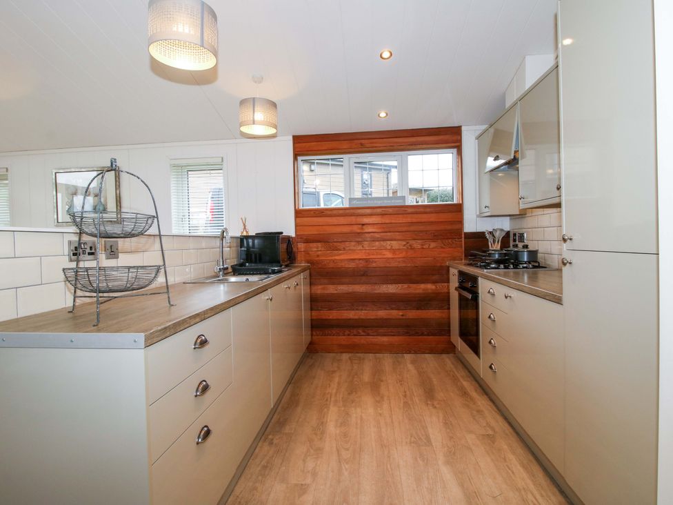 A kitchen with counter space and appliances at 5 Hillview Lodges Cleobury Mortimer
