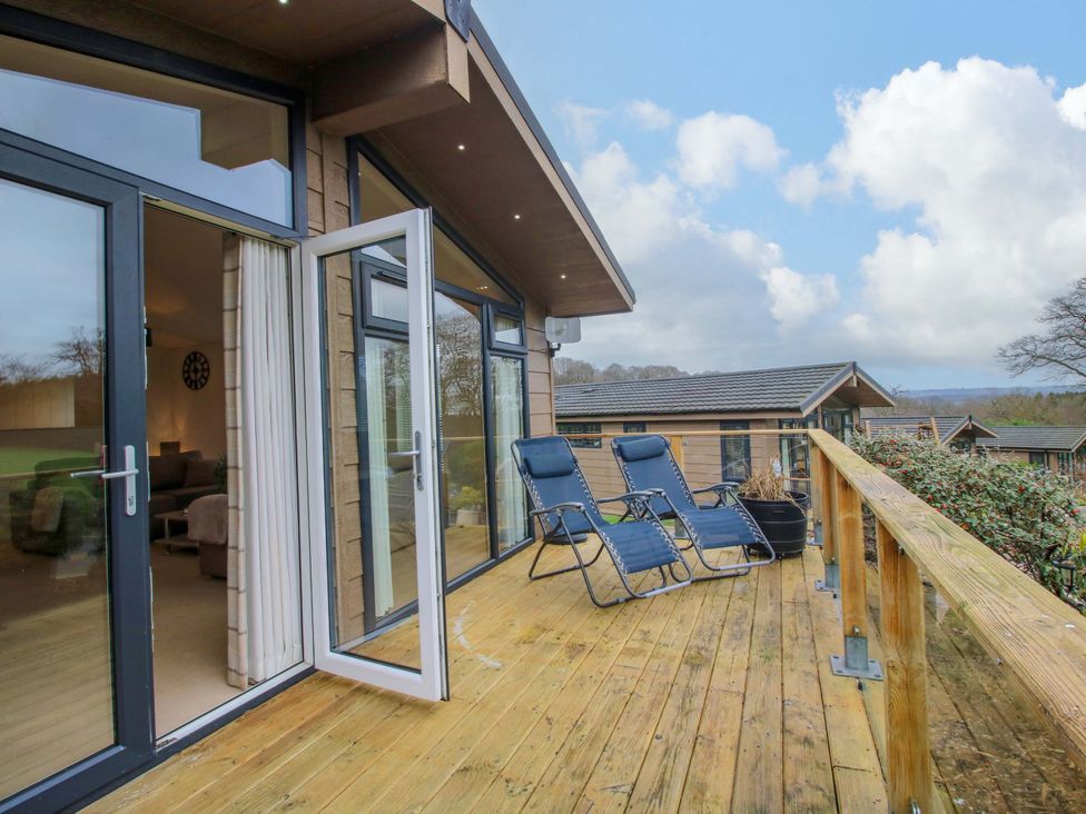 A deck with chairs and views at 5 Hillview Lodges in Cleobury Mortimer