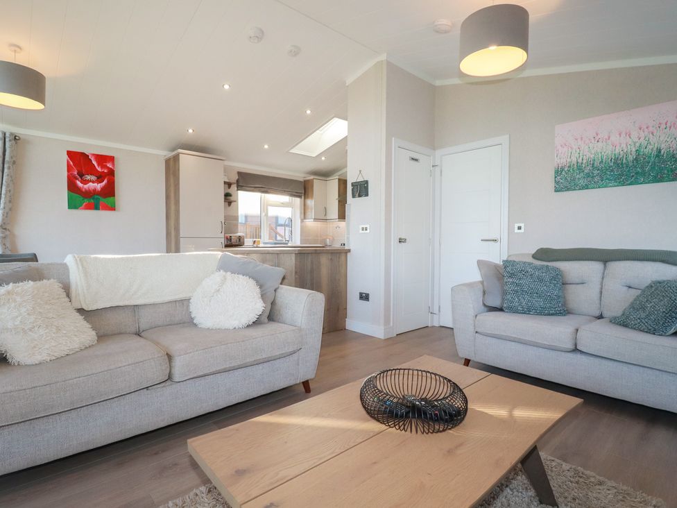 A living room with sofas and a coffee table at Moorland View