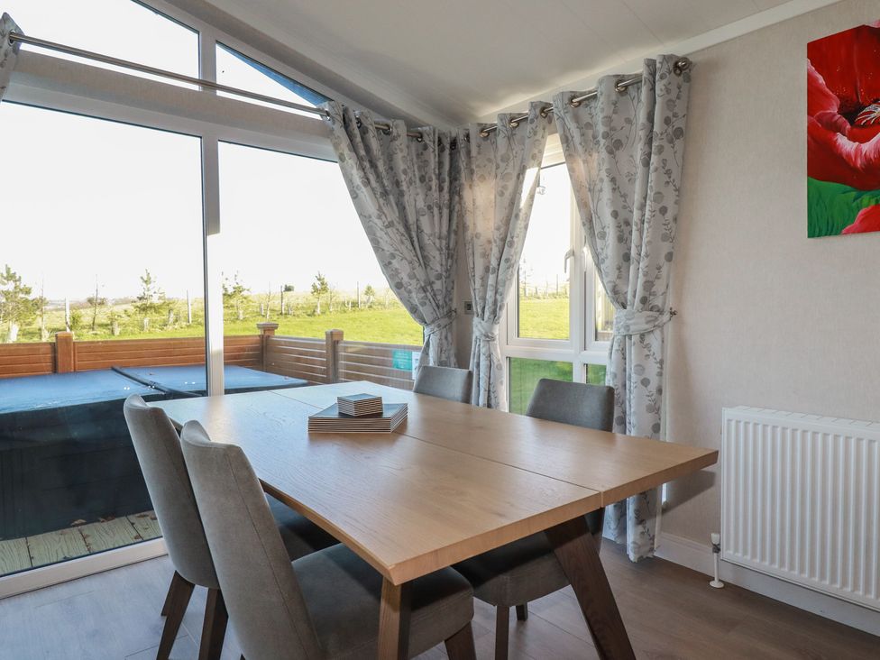 A dining room with a table and chairs at Moorland View