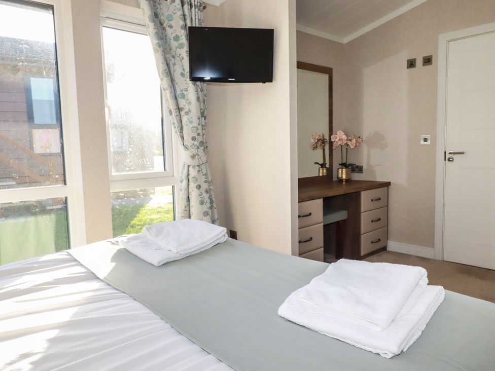A bedroom with a bed and television at Moorland View
