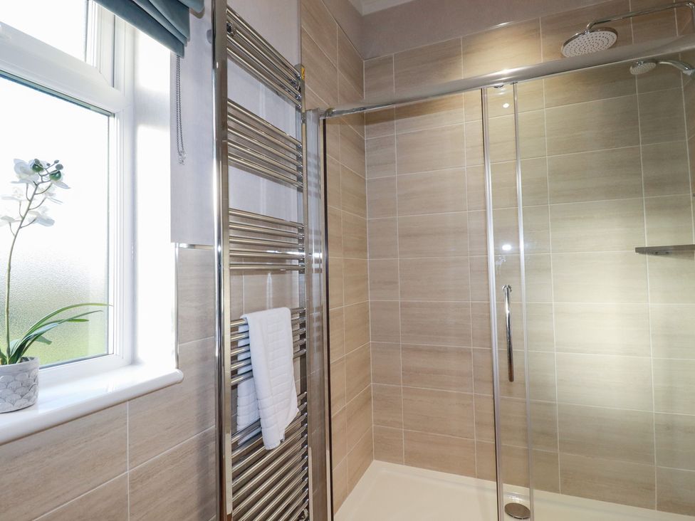 A bathroom featuring a shower and a towel rail at Moorland View