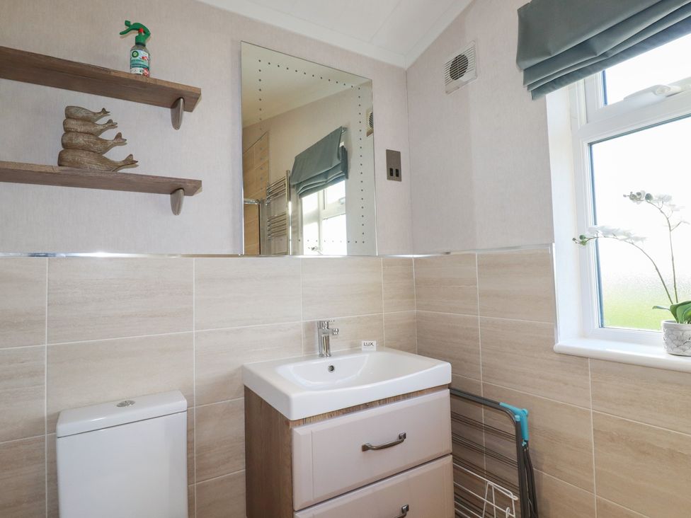A bathroom with a sink and toilet at Moorland View in 