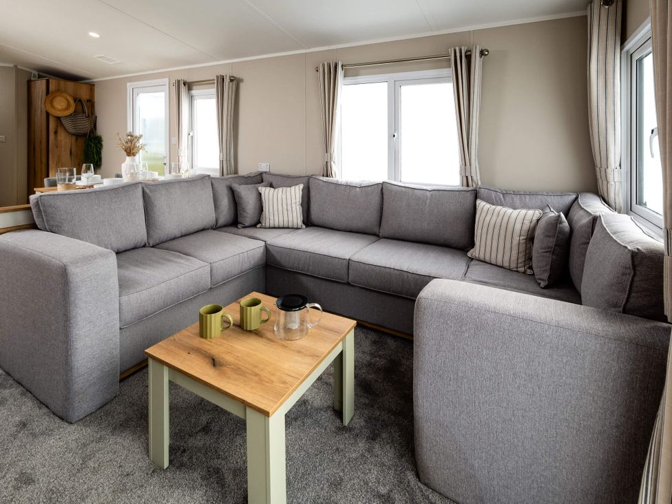 A living room with a grey sofa and coffee table at Ashberry 38 x 12 Two Bed - 3 in Northwich