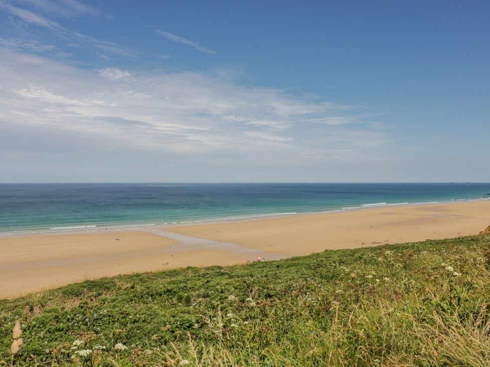 A beach view with sand and ocean at 3A Grannys Lane Perranporth
