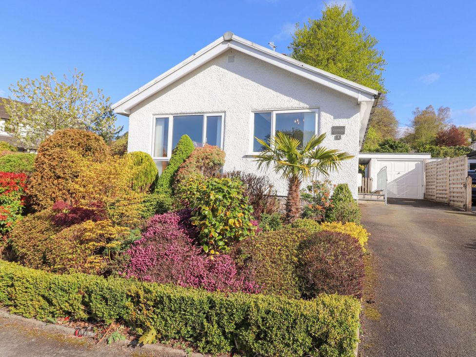 A house with a garden and driveway at Wansfell View in Ambleside