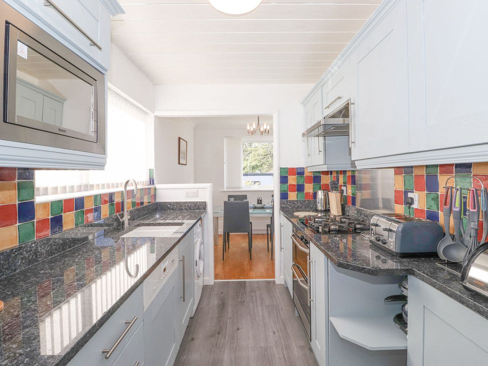 A kitchen with a countertop and dining area at Wansfell View in Ambleside