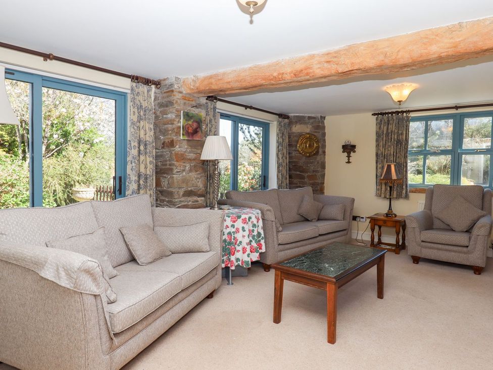 A living room with sofas and a coffee table at Pillars in Barnstaple