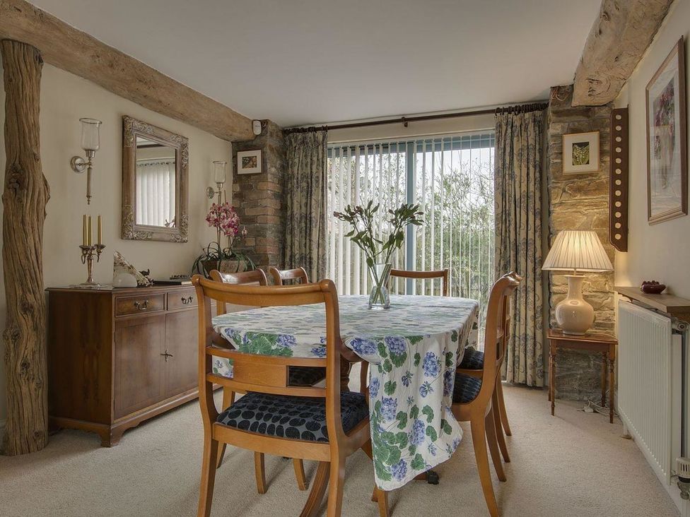 A dining room with a table and chairs at Pillars in Barnstaple