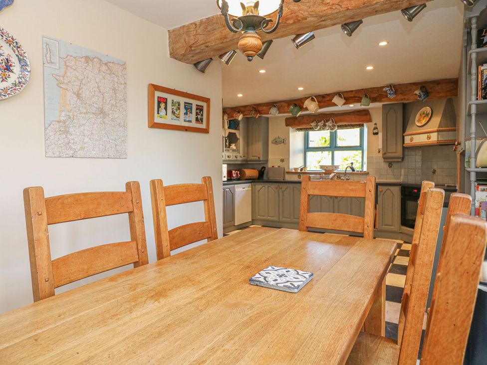 A dining room with a table and chairs at Pillars in Barnstaple