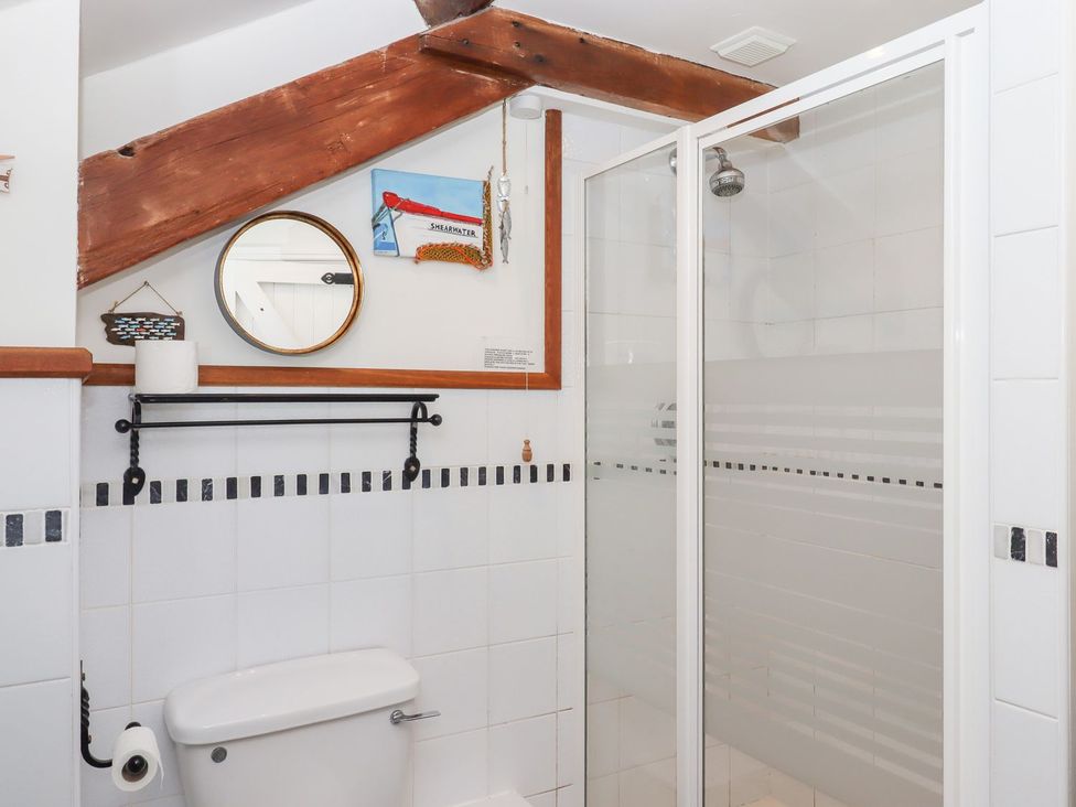 A bathroom with a shower and a toilet at Pillars in Barnstaple