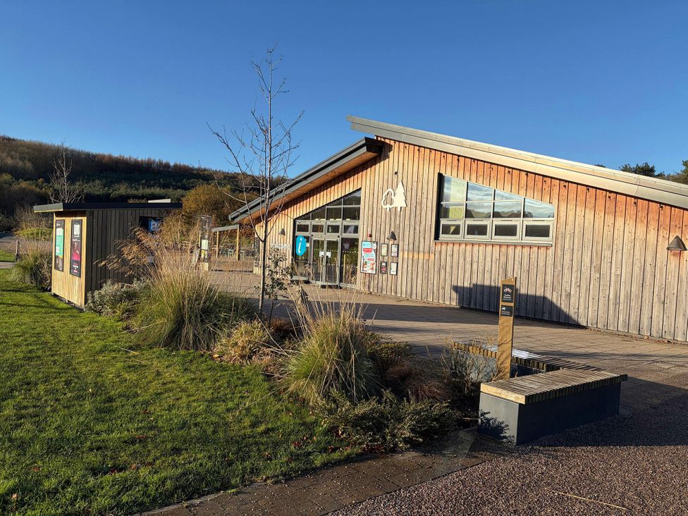 An information center with landscaping and benches at No 8 Sandstone Lodge Sanctuary Northwich