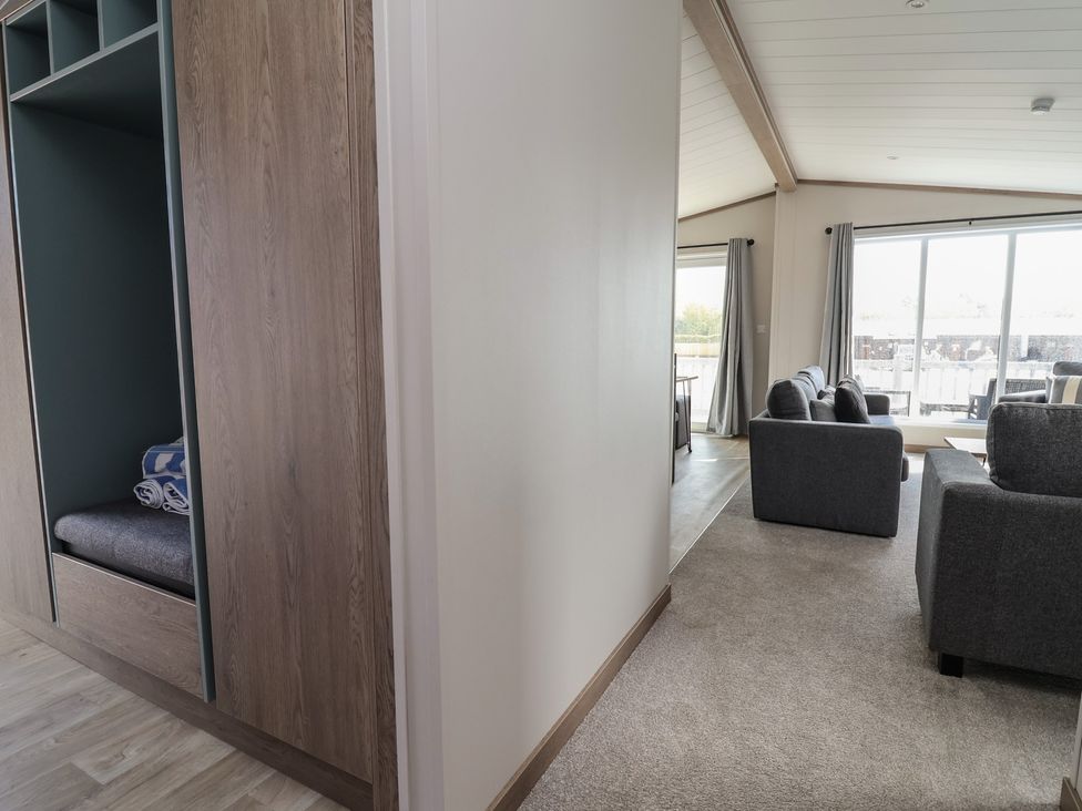 A living room with a couch and window at No.11 - Cedar Lodge in Delamere