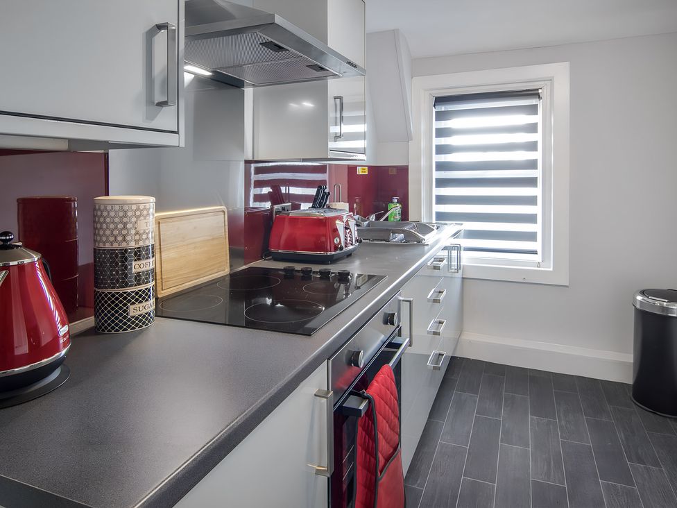 A kitchen with kettle and cooking items at Apartment 3 in Blackpool