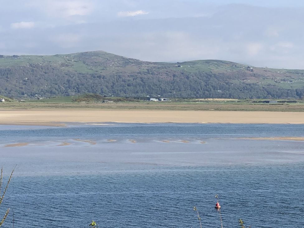 A body of water with land and mountains in the background at 12 Glyn terrace Borth-Y-Gest