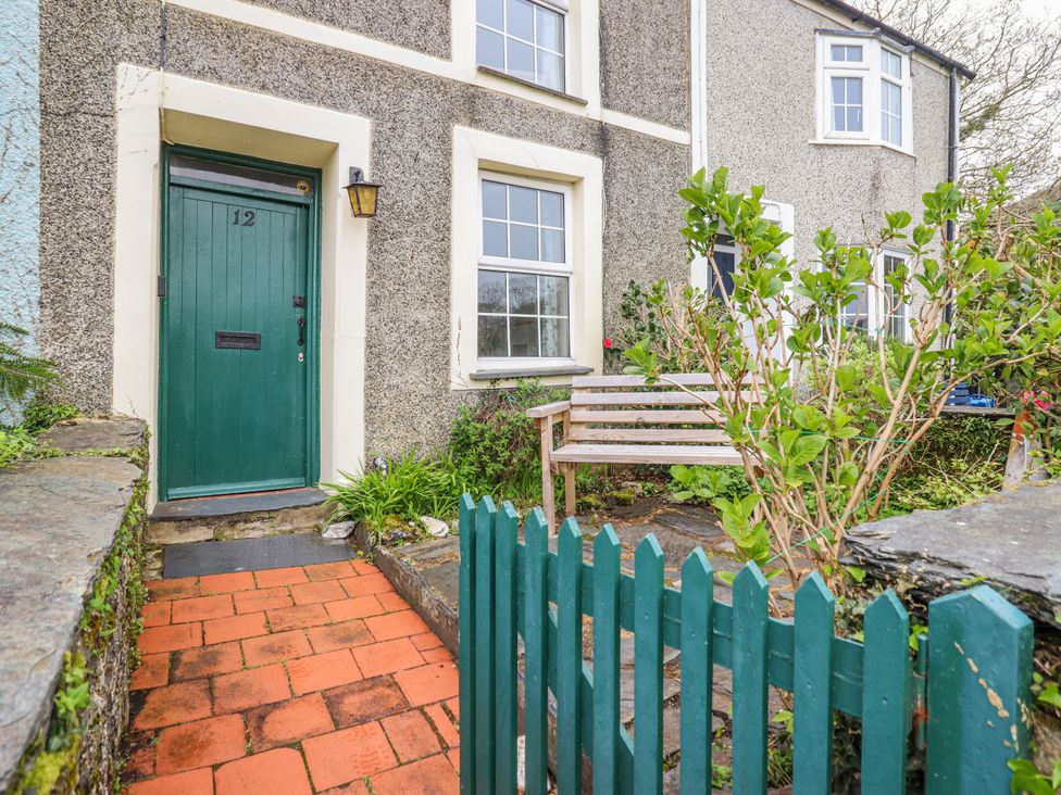 A front door and garden area at 12 Glyn Terrace in Borth-Y-Gest