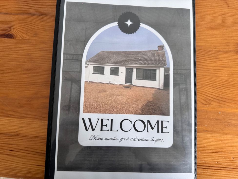 A house exterior with a sign saying welcome at 15 Lamsey Lane in King's Lynn