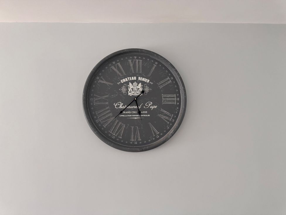 A wall clock on the wall at 15 Lamsey Lane in King's Lynn