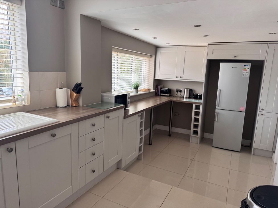 A kitchen featuring cabinets, a countertop, appliances at 15 Lamsey Lane King's Lynn