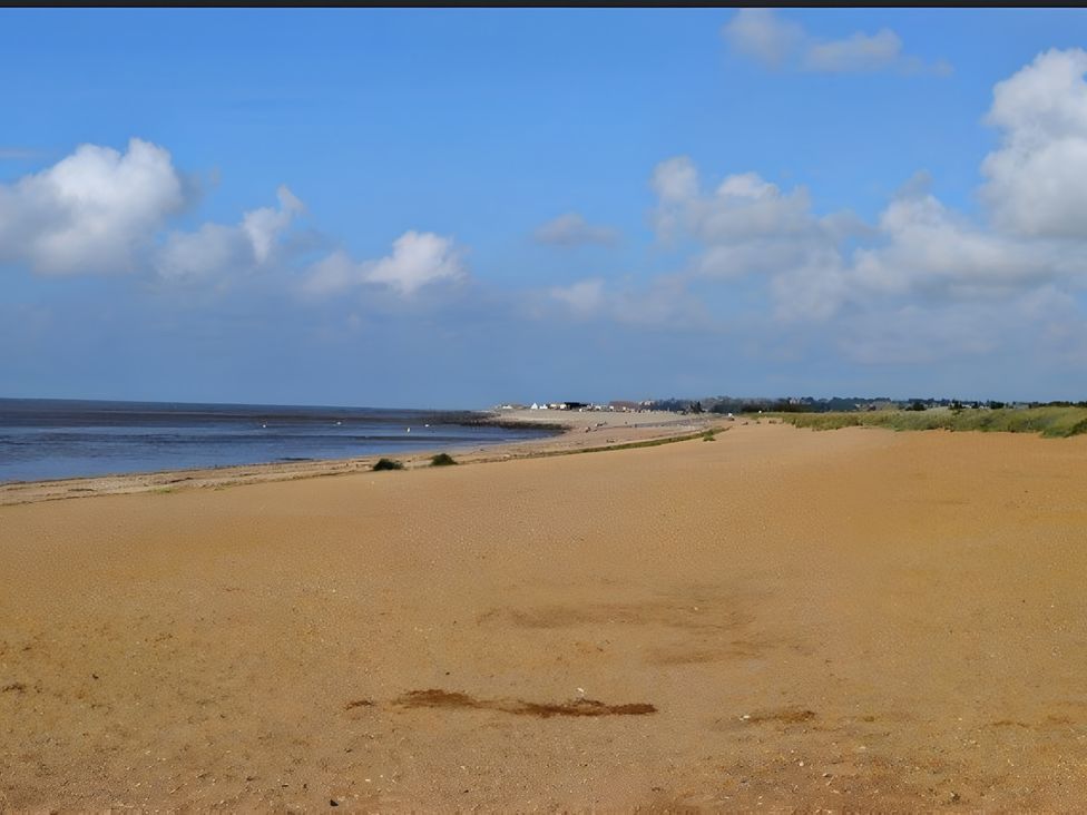 A beach with sand and water at 15 Lamsey Lane in King's Lynn