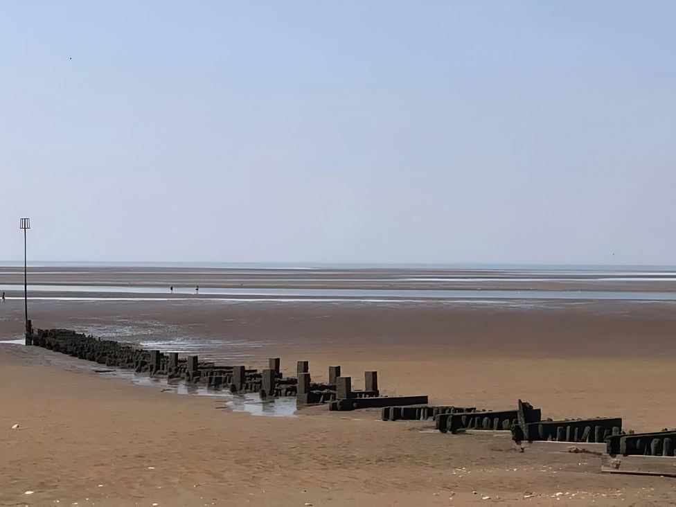 A beach with sea and groynes at 15 Lamsey Lane King's Lynn