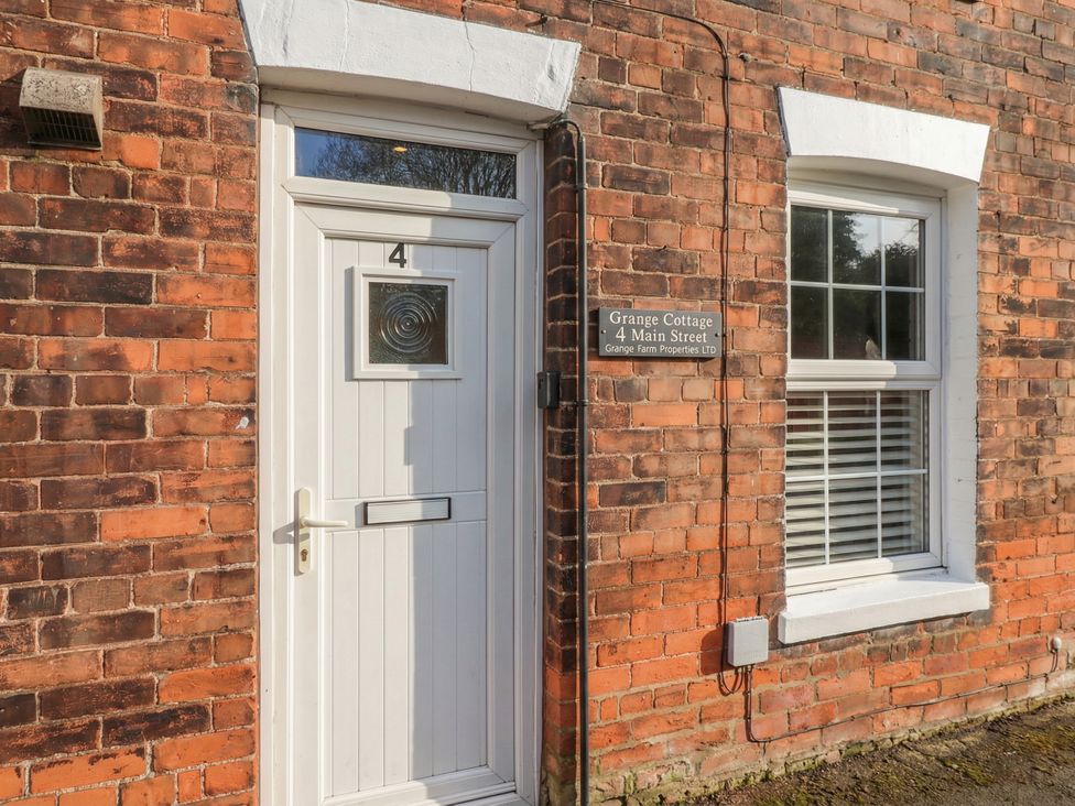 A door with a house number at Grange Cottage 4 Main Street in Hull