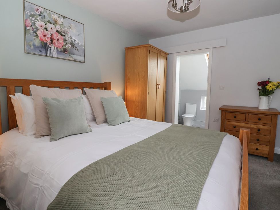 A bedroom with a bed and wardrobe at No.4 Main Street in Hull