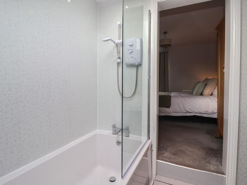 A bathroom with a bathtub and shower at No.4 Main Street in Hull